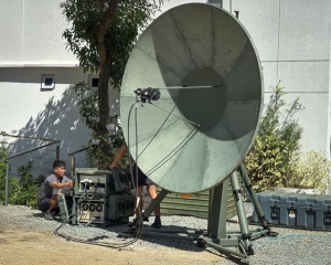 Members of the Armed Forces of the Philippines (AFP) conducting training with the MTTS Troposcatter system, featuring a large antenna dish and associated communication equipment in an outdoor setting.