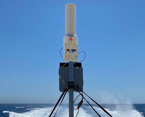 TOTM system antenna mounted on a maritime vessel during sea trials, demonstrating over-the-horizon communications while on the move.