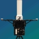 TOTM terminal showing the compact, ruggedised troposcatter system with vertically mounted advanced auto-tracking antenna. Designed for fast deployment hi-bandwidth data networks in mobile environments.