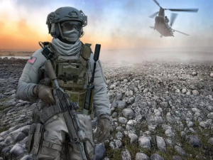 A soldier equipped with the GENSS tactical communications system moves across open terrain, with a helicopter hovering in the background. The image highlights GENSS’s operational deployment in dynamic, on-the-move environments.