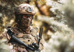 Soldier equipped with Spectra Group’s GENSS tactical radio system during field operations, demonstrating secure beyond line of sight communications.