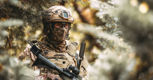 Soldier equipped with Spectra Group’s GENSS tactical radio system during field operations, demonstrating secure beyond line of sight communications.