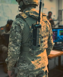 GENSS Soldier System radio mounted on the rear of a soldier’s plate carrier, illustrating lightweight, rugged beyond-line-of-sight tactical communications capability.